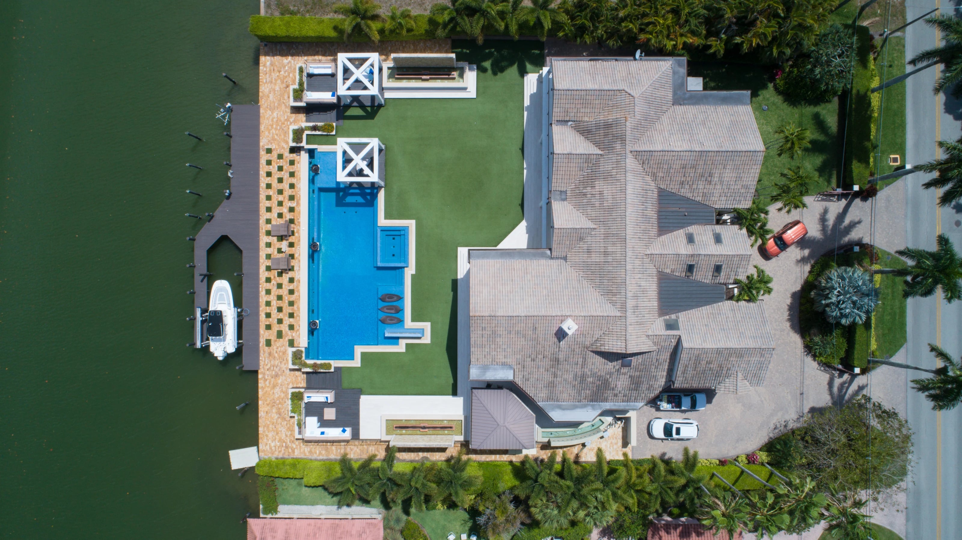 Aerial view of a waterfront home and canal in Port Royal, Naples